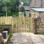 Beautiful custom-made wooden garden gate in natural wood finish, enhancing garden privacy and style. Perfect for traditional homes, handcrafted for durability and aesthetic appeal.